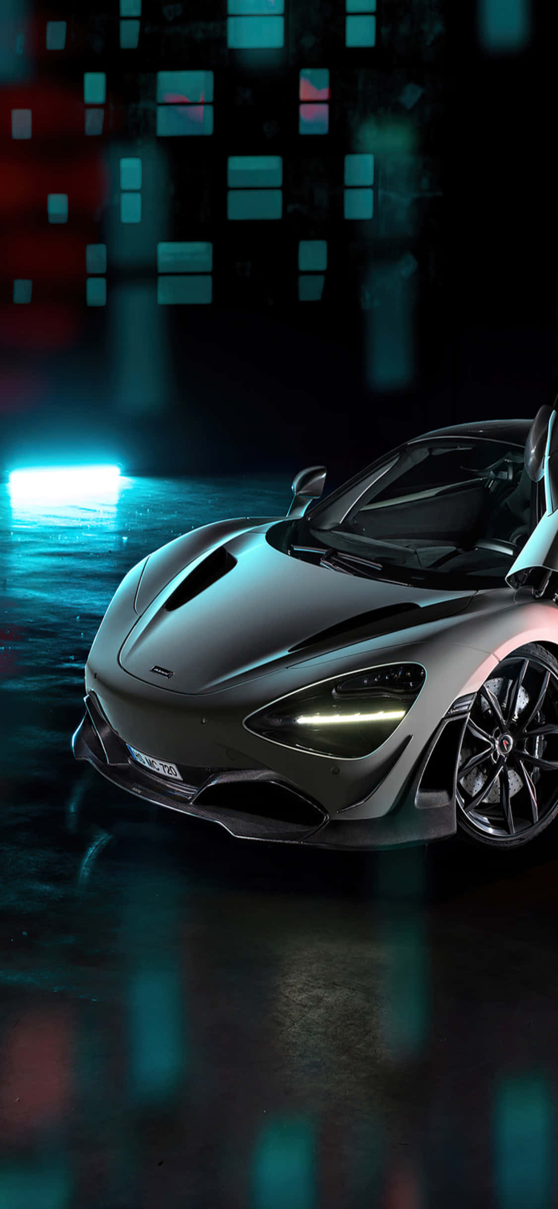 Sleek iPhone X with McLaren 720s Car Background 壁紙