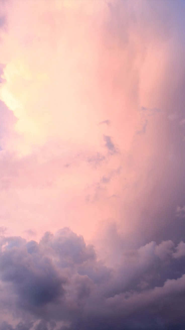 嬌嫩黃雲朵映襯粉紅天空 壁紙