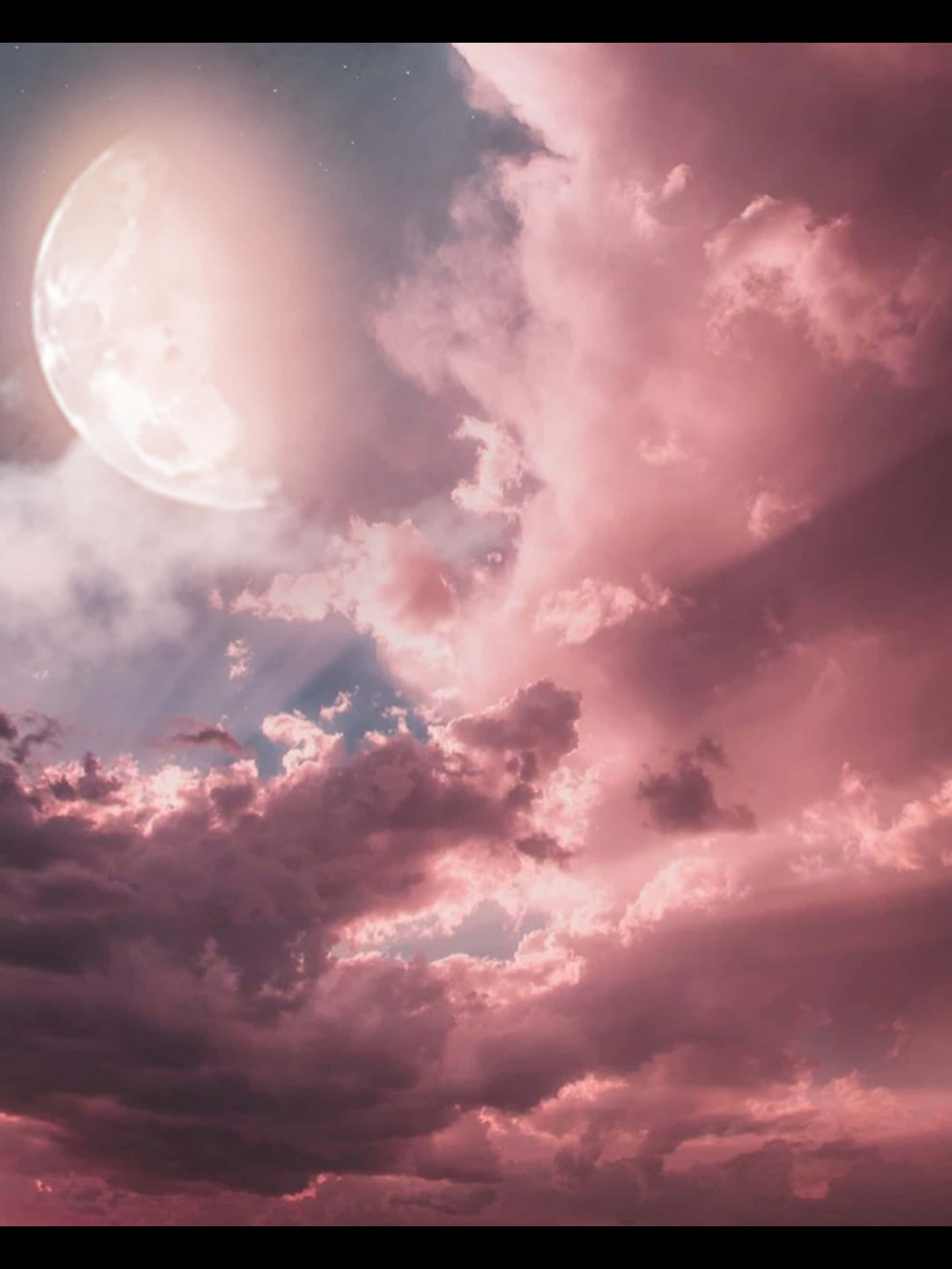 粉紅月亮與多雲天空 壁紙