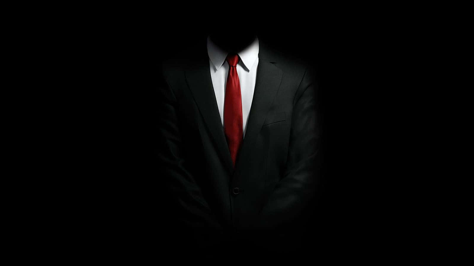 身穿西装领带的男子立于黑暗之中 壁紙