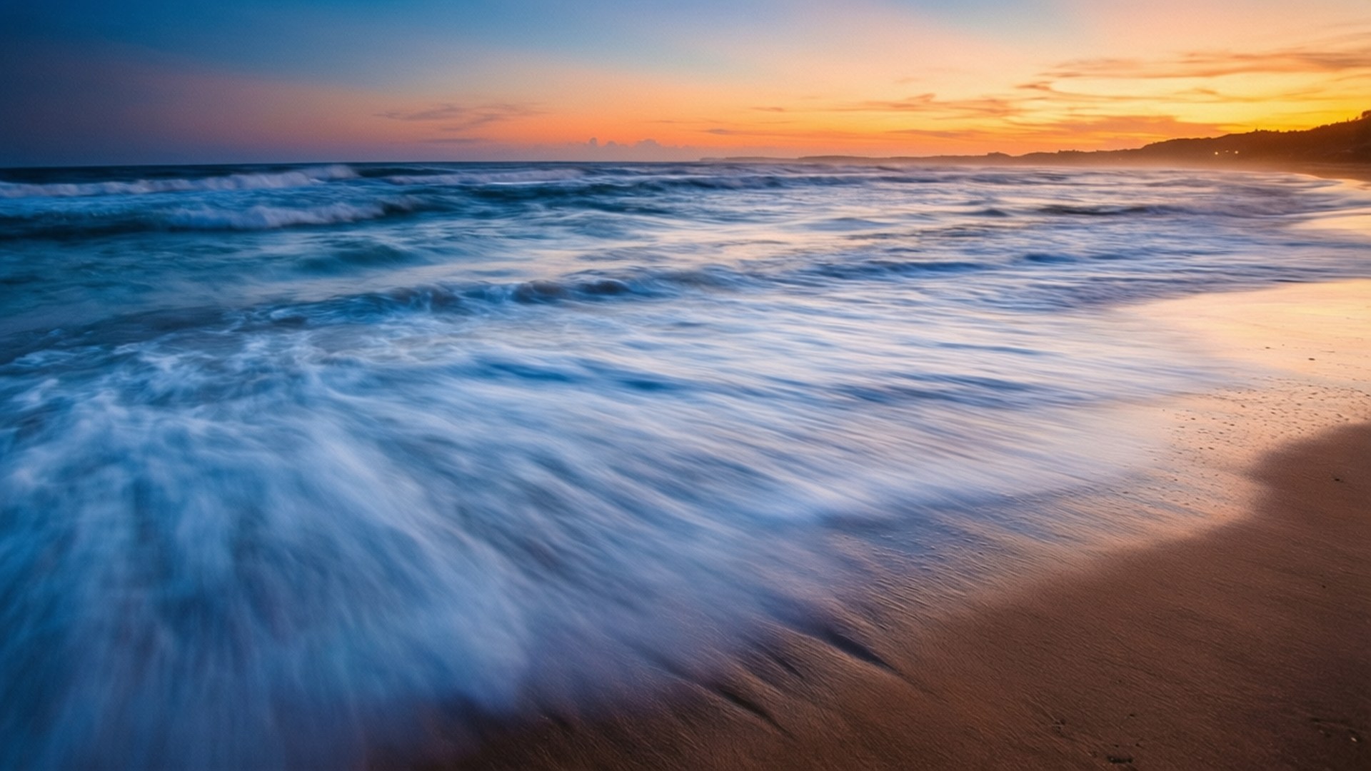 長曝光夕陽海浪 壁紙