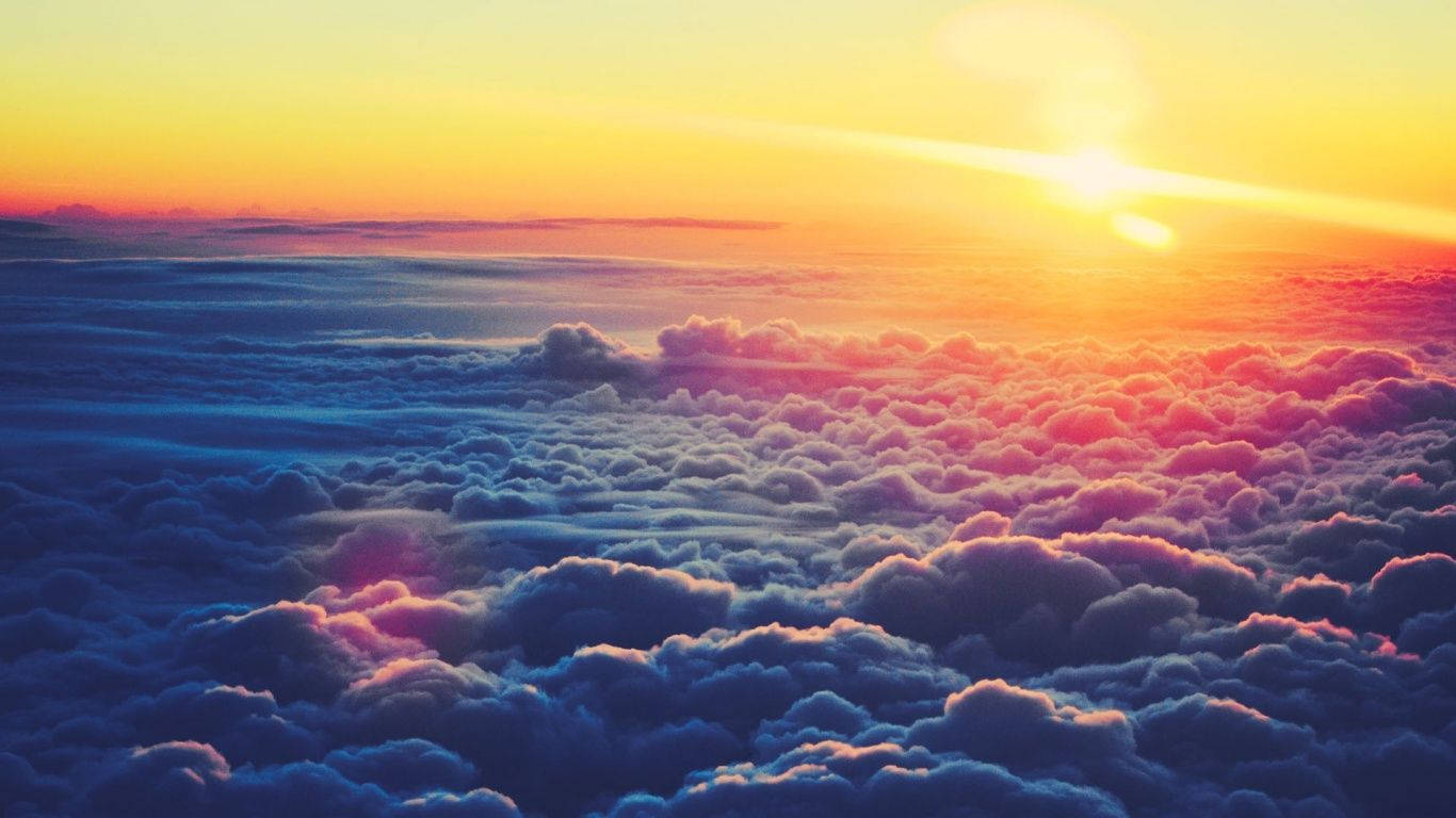雲端之上的美麗晴朗晨景 壁紙